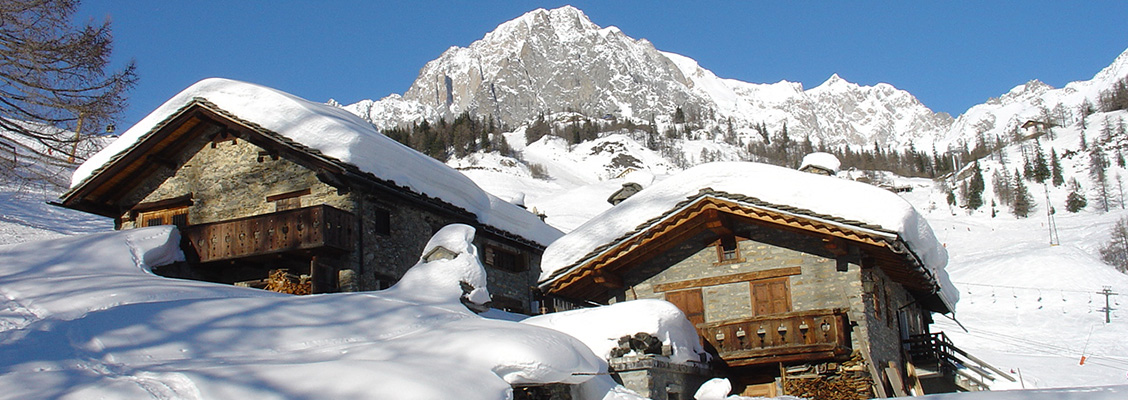 Snow covered huts in Courmayeur Italy