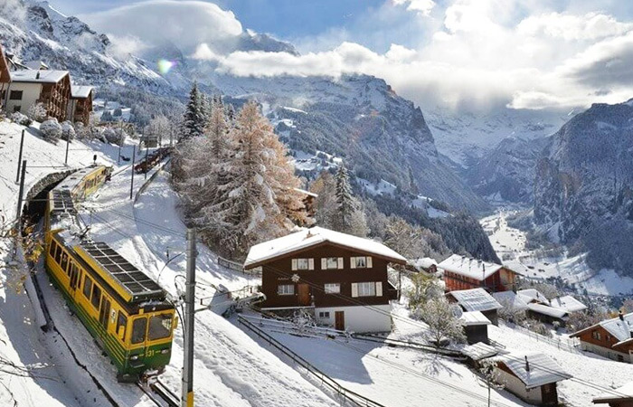Train ride through chocolate box ski resorts