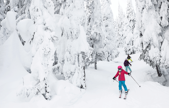 Family skiing in SilverStar, British Columbia
